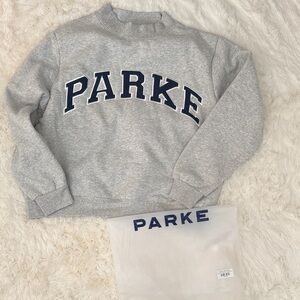 Parke Varsity Mockneck Grey/Navy Lettering. Never worn. Size L/XL